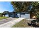 A single-story home featuring a gray exterior, a well-maintained lawn, and an attached garage at 714 Kankakee Ln, Orlando, FL 32807