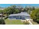 An aerial view of a single-story home featuring a well-kept exterior and manicured lawn at 714 Kankakee Ln, Orlando, FL 32807