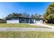 Charming single-story home featuring a gray exterior, well-maintained lawn, and attached garage at 714 Kankakee Ln, Orlando, FL 32807