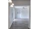 Bright living room with wood-look floors, fresh paint, and a sliding glass door to the outdoors at 714 Kankakee Ln, Orlando, FL 32807