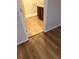 Bathroom featuring wood flooring, a tiled shower, and a vanity with a granite countertop at 717 Squires Grove Dr, Winter Haven, FL 33880