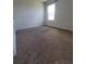 Bedroom featuring neutral carpet, a large window, and light gray walls at 717 Squires Grove Dr, Winter Haven, FL 33880