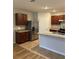 An open kitchen with stainless steel appliances and stone countertops at 717 Squires Grove Dr, Winter Haven, FL 33880