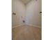 A tiled laundry room with water hookups and connections for laundry machines at 717 Squires Grove Dr, Winter Haven, FL 33880