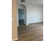 Open-concept living room with wood flooring and light gray walls at 717 Squires Grove Dr, Winter Haven, FL 33880