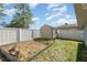 Fenced backyard, garden bed and storage shed at 75 Chaney Dr, Casselberry, FL 32707