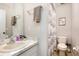 Bathroom featuring a sink, toilet, and bathtub with nautical themed shower curtain at 75 Chaney Dr, Casselberry, FL 32707