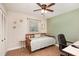 Cozy bedroom featuring natural light, tile flooring, and a ceiling fan at 75 Chaney Dr, Casselberry, FL 32707