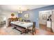 Dining room with modern blue walls and a decorative wood dining table at 75 Chaney Dr, Casselberry, FL 32707