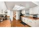 Traditional kitchen with stainless steel appliances, a window over the sink, and a view of the living space at 75 Chaney Dr, Casselberry, FL 32707