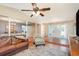 Bright living room features hardwood floors, white french doors, and open access to the dining area for easy living at 75 Chaney Dr, Casselberry, FL 32707