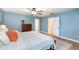Comfortable main bedroom with natural light, wood-look tile floors, and closet at 75 Chaney Dr, Casselberry, FL 32707