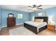 Comfortable main bedroom featuring natural light, a ceiling fan, and wood-look tile floors at 75 Chaney Dr, Casselberry, FL 32707