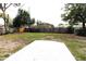 Large backyard with a concrete patio, perfect for relaxing or entertaining guests at 904 Crestwood Ln, Altamonte Springs, FL 32701