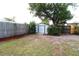 Backyard view featuring a storage shed and a well-maintained lawn at 904 Crestwood Ln, Altamonte Springs, FL 32701