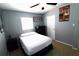 Cozy bedroom with neutral walls, ceiling fan, and decorative wall art at 904 Crestwood Ln, Altamonte Springs, FL 32701