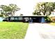 Charming one-story home with a well-maintained lawn and covered parking at 904 Crestwood Ln, Altamonte Springs, FL 32701