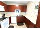 A well-lit kitchen featuring wooden cabinetry and white countertops at 904 Crestwood Ln, Altamonte Springs, FL 32701