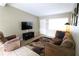 An inviting living room featuring neutral walls and ceramic tile flooring at 904 Crestwood Ln, Altamonte Springs, FL 32701
