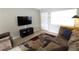 A bright living room featuring neutral walls and ceramic tile flooring at 904 Crestwood Ln, Altamonte Springs, FL 32701