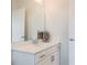 Bright bathroom with a white vanity, a large mirror, and stylish decorations that add character at 3881 Sonoma Blvd, Kissimmee, FL 34741