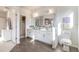 Bathroom highlighting double sinks, modern fixtures, tile flooring, and recessed lighting at 3881 Sonoma Blvd, Kissimmee, FL 34741