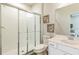 Clean bathroom with a glass-enclosed shower, white vanity, and neutral decor, creating a serene atmosphere at 3881 Sonoma Blvd, Kissimmee, FL 34741