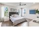 Bright bedroom with stylish decor, natural light, and wood-look flooring, creating a tranquil retreat at 3881 Sonoma Blvd, Kissimmee, FL 34741