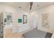 Bright bedroom featuring doorways to a bathroom and hallway, plus modern furnishings and an updated ceiling fan at 3881 Sonoma Blvd, Kissimmee, FL 34741