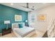Stylish bedroom with modern decor, an accent wall, and plush carpeting at 3881 Sonoma Blvd, Kissimmee, FL 34741