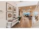 Inviting foyer with elegant artwork and view of open floor plan flowing into the living area at 3881 Sonoma Blvd, Kissimmee, FL 34741
