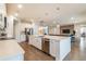 Open concept kitchen featuring an island, and stainless steel appliances, with views into the living room at 3881 Sonoma Blvd, Kissimmee, FL 34741