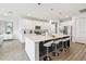 Bright, modern kitchen features stainless steel appliances, a large center island, and ample white cabinetry at 3881 Sonoma Blvd, Kissimmee, FL 34741
