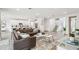 Open-concept living space featuring a modern kitchen, comfortable seating, and stylish decor at 3881 Sonoma Blvd, Kissimmee, FL 34741