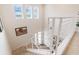 Bright open staircase with modern white railings and multiple windows providing natural light at 3881 Sonoma Blvd, Kissimmee, FL 34741