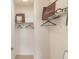 A walk-in closet features minimalist white wire shelving and ample hanging storage at 3881 Sonoma Blvd, Kissimmee, FL 34741