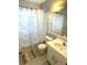 Cozy bathroom with a shower/tub combo and seashell-themed shower curtain at 1018 Martin Blvd, Orlando, FL 32825