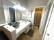 Spacious bathroom with a long vanity, ample lighting, and a separate shower and toilet area at 1018 Martin Blvd, Orlando, FL 32825