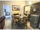 Cozy dining area beside the kitchen, featuring wood accents and a view to the bedroom at 1018 Martin Blvd, Orlando, FL 32825