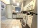 Well-lit kitchen includes white appliances, plentiful storage, and a convenient layout at 1018 Martin Blvd, Orlando, FL 32825