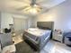 Serene main bedroom with neutral tones, ceiling fan, and a sliding glass door at 1018 Martin Blvd, Orlando, FL 32825