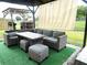 Outdoor patio area with comfortable seating and a dining table, perfect for entertaining at 1018 Martin Blvd, Orlando, FL 32825