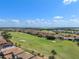 Aerial view of community with golf course, pristine lakes and beautiful residential neighborhood at 10257 Henbury St, Orlando, FL 32832