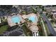 An aerial view of the community pool, bathhouse, and splash area at 10257 Henbury St, Orlando, FL 32832