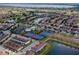 Aerial view of community featuring ponds, clubhouse, swimming pool, and recreational courts at 10257 Henbury St, Orlando, FL 32832