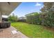 Spacious backyard with green lawn, patio and privacy fence offering ample outdoor space at 10257 Henbury St, Orlando, FL 32832
