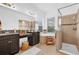 A bright and luxurious bathroom with double sinks, garden tub, and a glass shower enclosure at 10257 Henbury St, Orlando, FL 32832