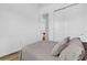 Cozy bedroom with closet and ensuite bath, light wood flooring and calming decor at 10257 Henbury St, Orlando, FL 32832