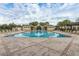 Community pool featuring a zero entry wading area and several lounge chairs for residents at 10257 Henbury St, Orlando, FL 32832