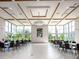 Spacious community room with elegant lighting, large windows, and seating arrangements at 10257 Henbury St, Orlando, FL 32832